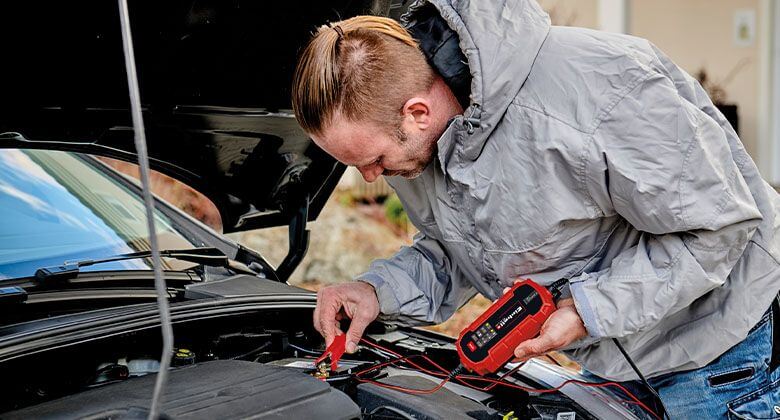 man using a battery charger