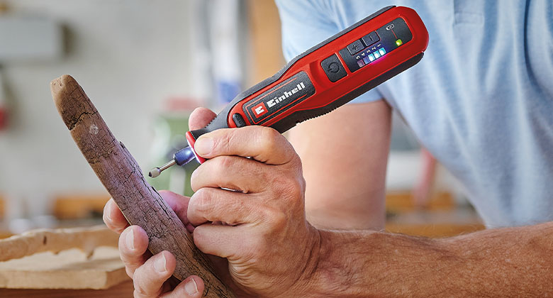 man using corless grinding/engraving tool