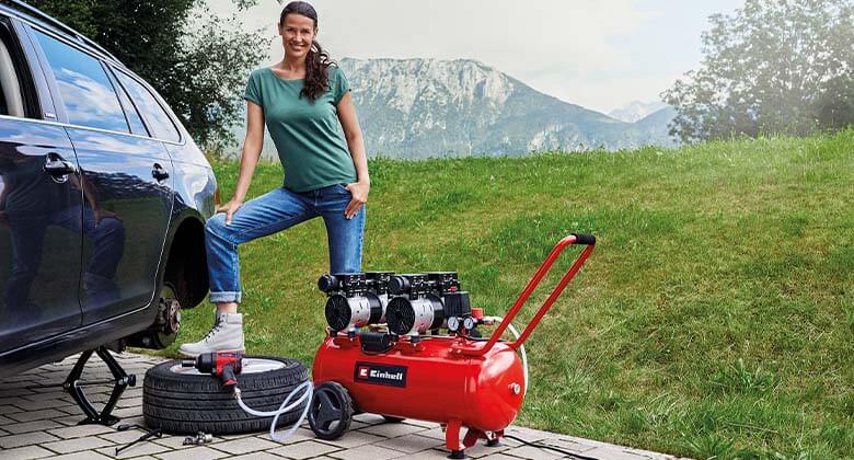 woman using an air compressor 